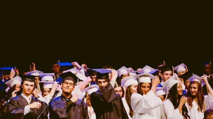 College Students Graduating with wearing hat